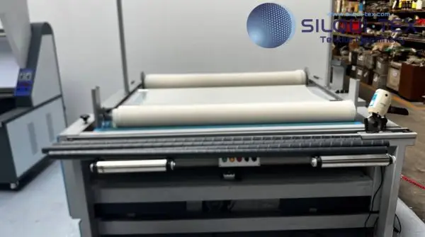 Máquina revisadora de tela Silqui-Tex Machinery para inspección y enrollado de tejidos